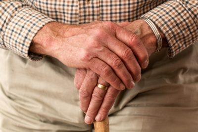 A person's hands crossed over one another