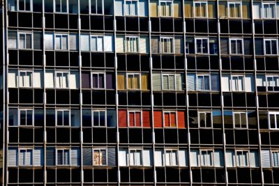 Apartment building, with different colours on it, and windows. Representing a variety of learners.