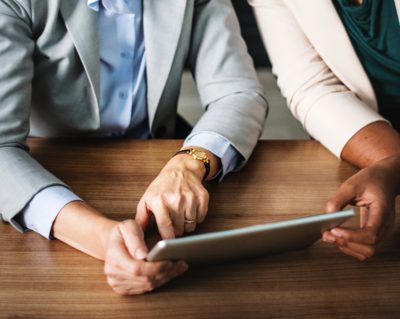 two people looking at tablet