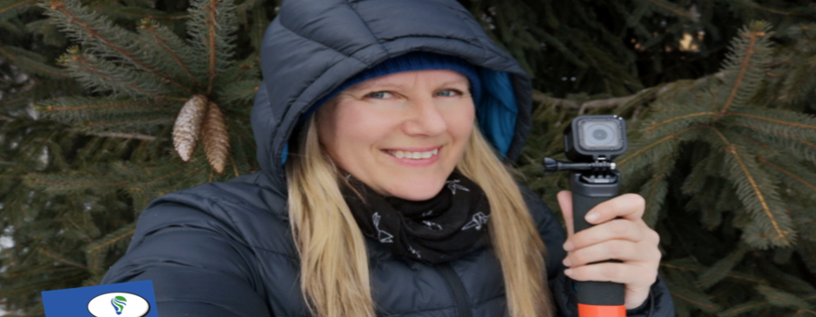 #10DAYTACKLE Patricia Regier holding GoPro with winter coat on