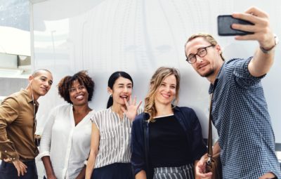 A group of people taking a selfie