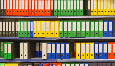 shelves of coloured binders