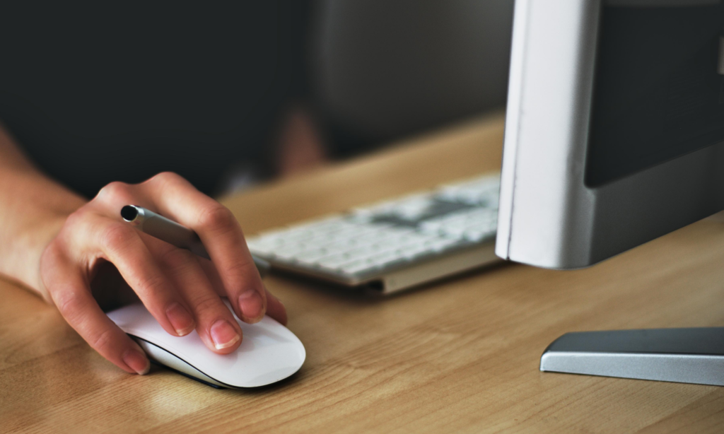 person clicking computer mouse