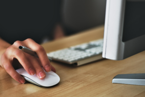 person clicking computer mouse