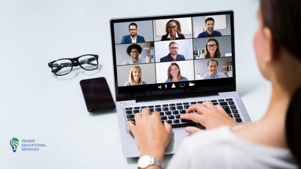 woman typing on laptop with 9 people on video conference who may have Zoom Fatigue