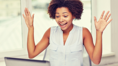 person happy looking at computer