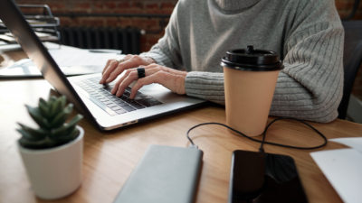 person typing on laptop