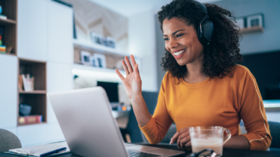 Woman listening to music on a video conference meeting