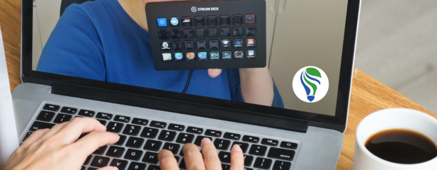 Photo from Canva. Hands typing on laptop keyboard, cup of coffee on table. Patricia holding Stream Deck, on the laptop screen.