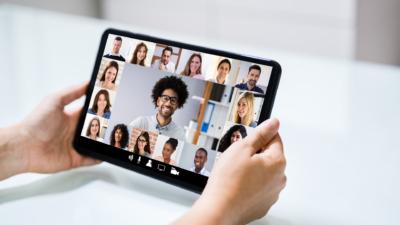 variety of people on a tablet video meeting