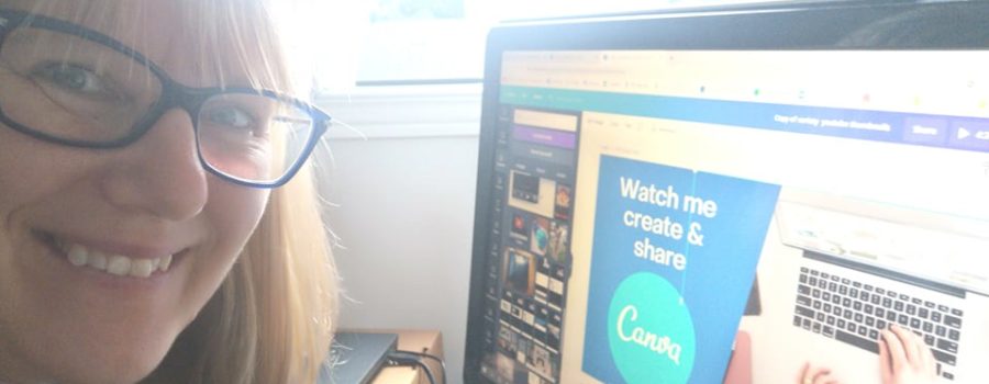 Patricia at her desk, in front of her computer smiling