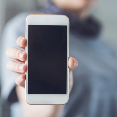 image of person holding her cell phone up