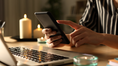 computer and phone, with candles power outage