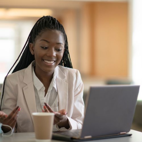 image of woman with laptop chatting through online break