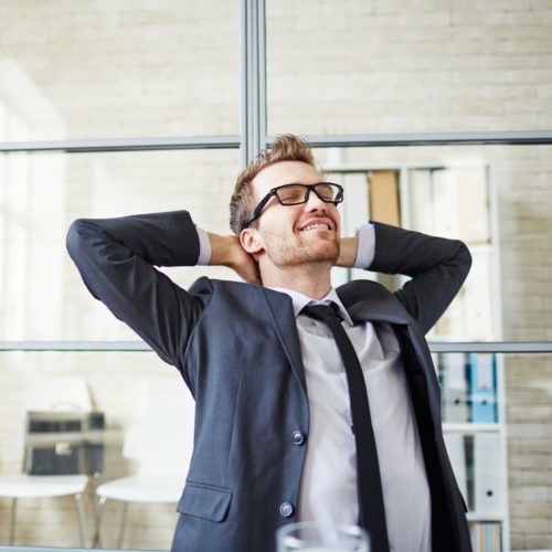 image of man stretching through online meeting break