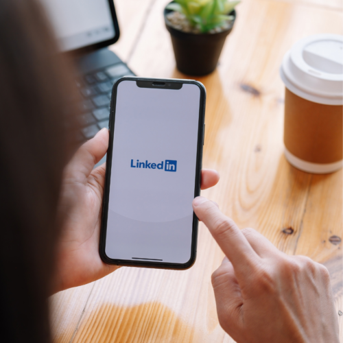 image of phone with LinkedIn logo on screen