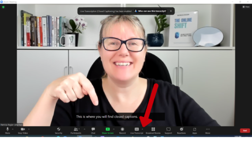 Patricia pointing to closed captions in Zoom meeting