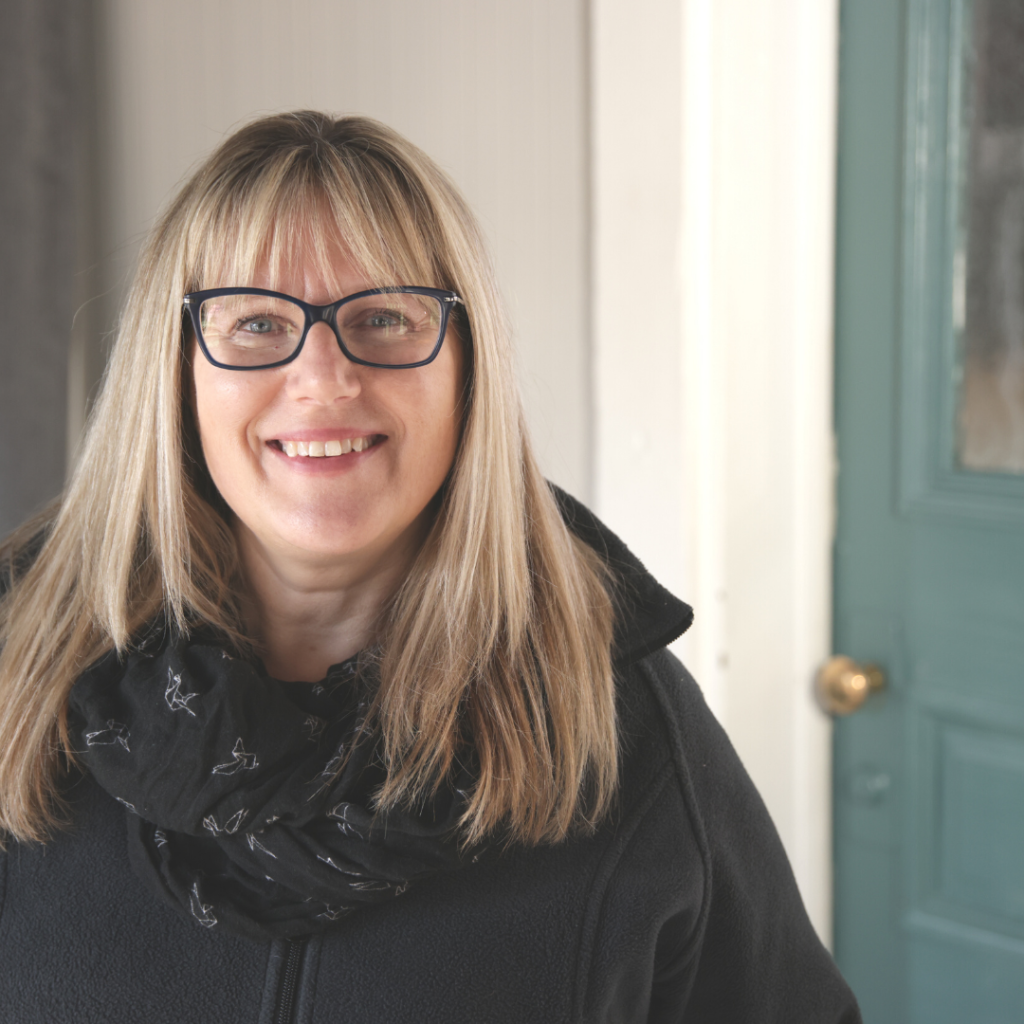 patricia in front of a door