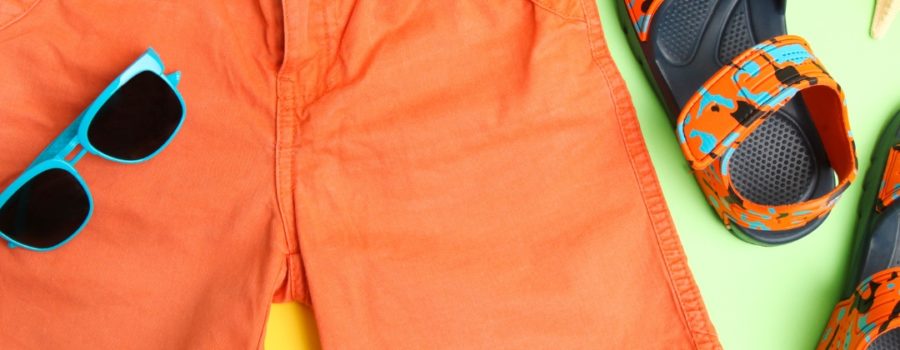 image of orange shorts and sandles with blue sunglasses on a yellow and green background for hot pro tips