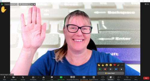 image of Patricia Regier showing how Zoom can now recognize hand gestures by raising her hand