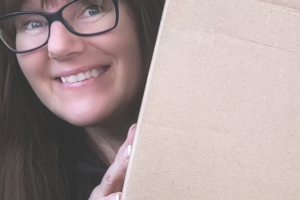 Patricia holding a box