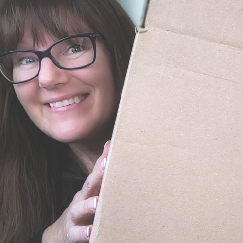 Patricia holding a box