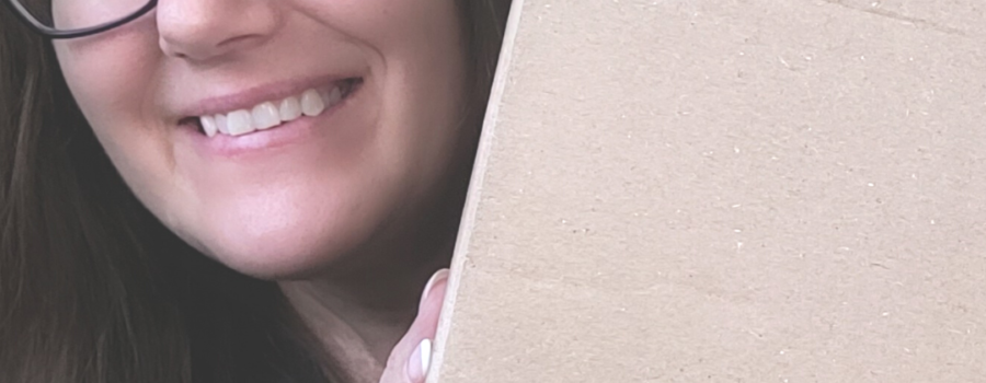 Patricia holding a box