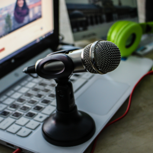 laptop microphone and green headset