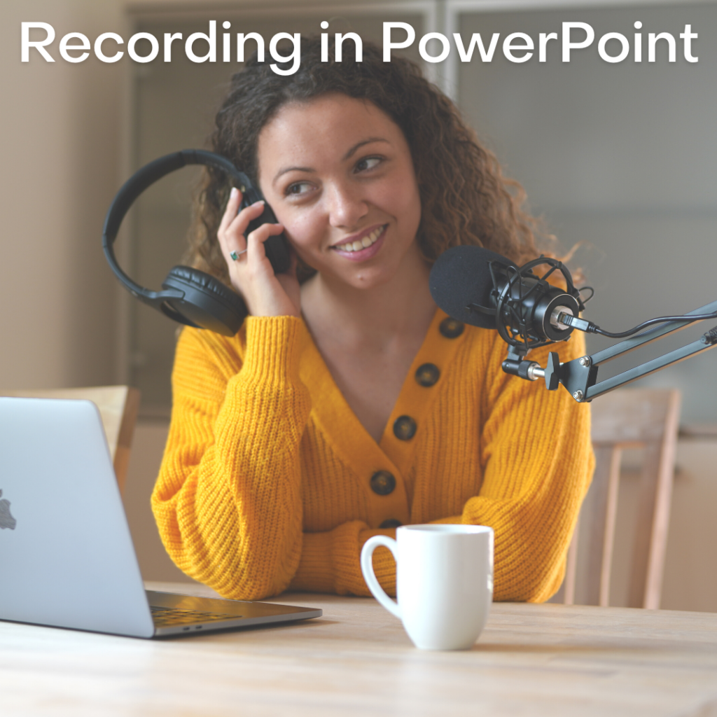 woman in yellow sweater listening to a recording in a headset, mic and laptop with a mug on table