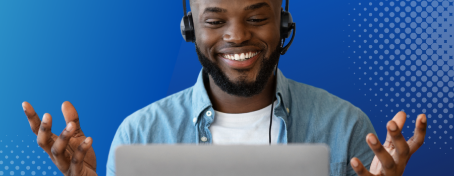 LIVE STREAM TIPS. BLACK MAN WITH HEAD SET ON HANDS UP SMILING AT LAP TOP