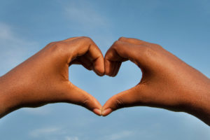 Facilitator self care hands in a heart shape