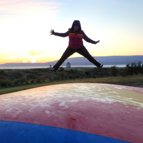 Patricia jumping on a trampoline in Iceland